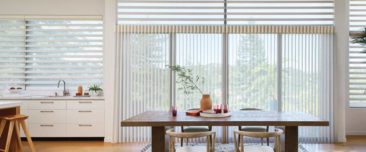 Dining room with Design Studio curtains and Roman Shades.